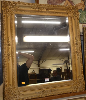 Lot 472 - A gilt composition framed and bevelled...