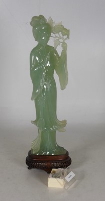 Lot 213 - A Chinese simulated jade figure of a lady in a...