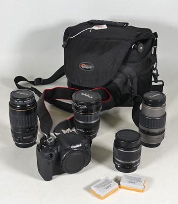 Lot 251 - A Canon EOS 700D camera body, together with...