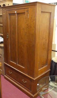 Lot 556 - A pitch pine single door wardrobe, with single...