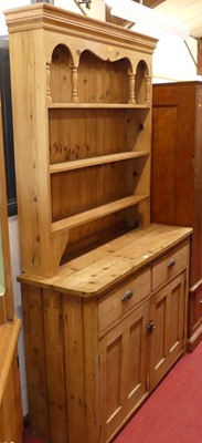 Lot 557 - A Victorian pine round cornered dresser base,...