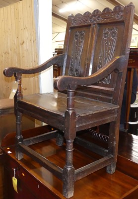Lot 565 - An antique joined oak and relief carved twin...