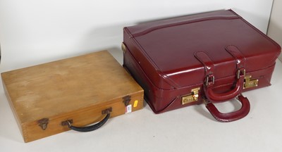Lot 169 - An oxblood red leather travel case, with...