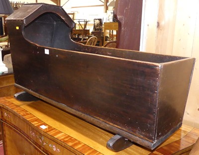 Lot 569 - An antique stained walnut baby's rocking crib,...