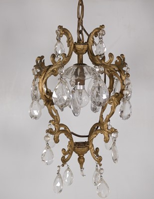 Lot 173 - A 20th century brass framed four-tier ceiling...