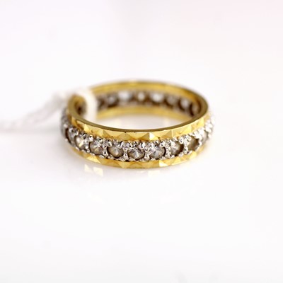 Lot 344 - An 18ct gold zircon set eternity ring, size...
