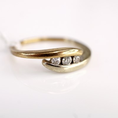 Lot 347 - A 9ct gold diamond crossover ring, arranged as...