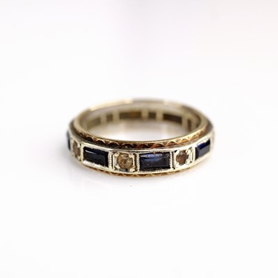 Lot 348 - A 9ct white gold, blue sapphire and white...