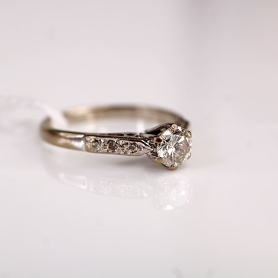 Lot 355 - An 18ct white gold diamond solitaire ring, the...