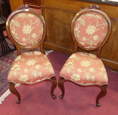 Lot 634 - A pair of mid-Victorian mahogany balloon back...