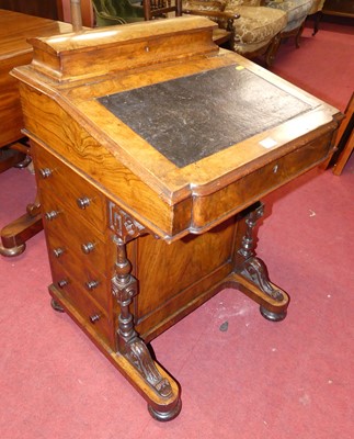 Lot 595 - A mid-Victorian figured walnut slope front...