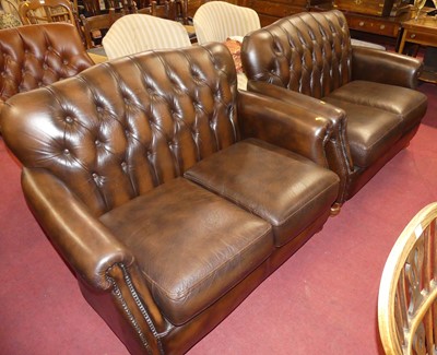 Lot 640 - A pair of Thomas Lloyd tan leather buttonback...