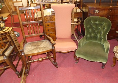 Lot 648 - A provincial elm and fruitwood spindle back...