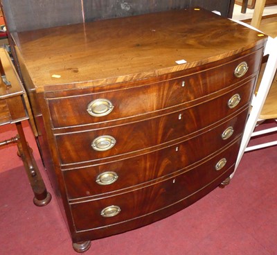 Lot 599 - A Regency mahogany bow front chest of four...