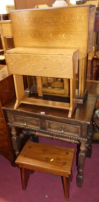 Lot 659 - An early 20th century oak single drawer side...
