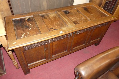 Lot 607 - A joined oak four panelled hinge top coffer,...