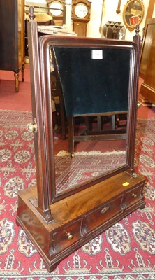 Lot 608 - A George III mahogany swing dressing mirror,...