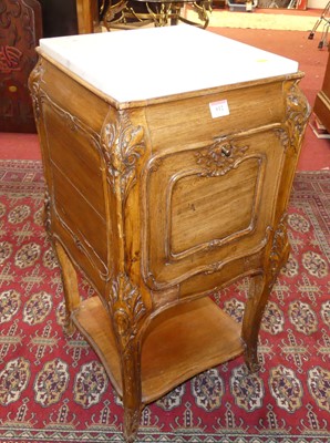 Lot 612 - A Provincial French walnut and white marble...