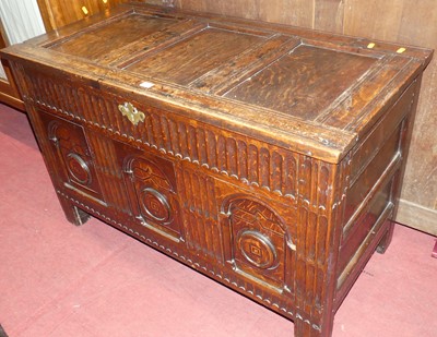 Lot 671 - An antique joined oak three-panel hinge topped...
