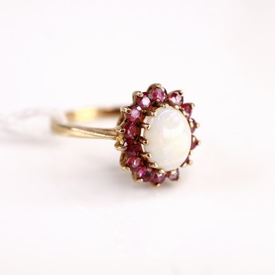 Lot 381 - A 9ct ruby and opal flower head cluster ring,...