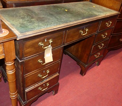 Lot 686 - A circa 1900 mahogany and hide inset kneehole...