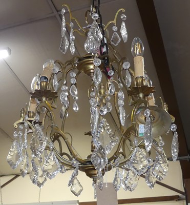 Lot 631 - A gilt metal and cut crystal glass drop...