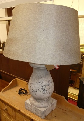 Lot 690 - An aged pottery grey painted bulbous table...