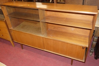 Lot 671 - A 1970s teak freestanding bookcase, having...
