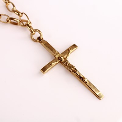Lot 376 - A 9ct gold crucifix pendant, 4cm, on 9ct gold...