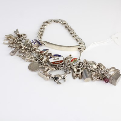 Lot 404 - A silver identity bracelet together with one...