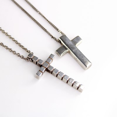 Lot 413 - An Emporio Armani silver cross pendant on a...