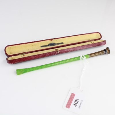 Lot 408 - A cased Art Deco green bakelite and enamel...