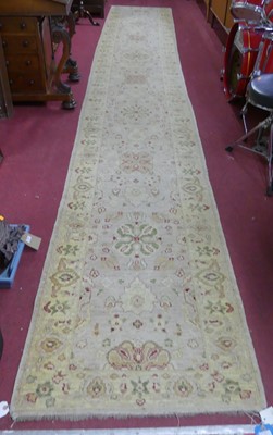 Lot 713 - A Turkish pale ground woollen Oushak long hall...