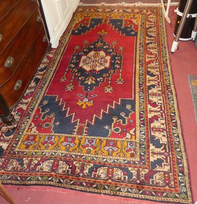 Lot 715 - A Turkish woollen red, blue and cream ground...