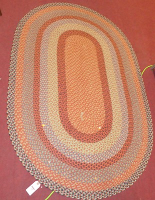 Lot 716 - A braided oval Jute rug, 185 x 120cm