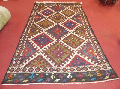 Lot 725 - An Anatolian woollen kilim rug, geometric...