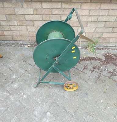 Lot 726 - A vintage green painted metal hose reel cart