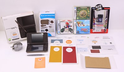 Lot 431 - Nintendo DSI XL boxed portable console, Brain...