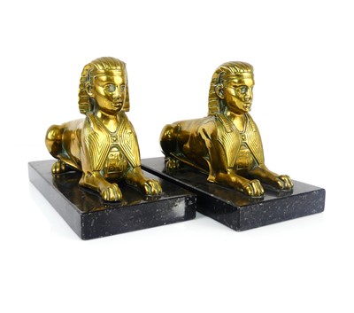 Lot 356 - A pair of 1930s gilt brass book-ends, modelled...