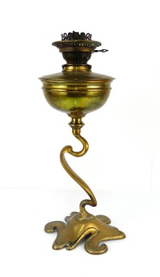 Lot 344 - An Art Nouveau brass oil lamp by Hinks of...