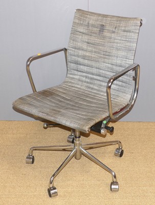 Lot 696 - After Charles Eames - a chromed metal framed...