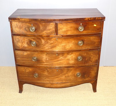 Lot 652 - A Regency mahogany bow front chest of drawers,...