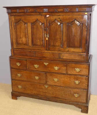 Lot 663 - A George III oak Welsh livery cupboard, the...