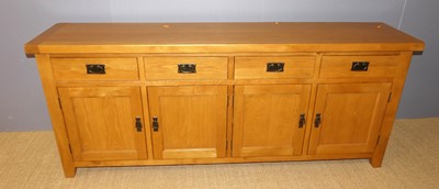 Lot 661 - A large contemporary joined blond oak four...