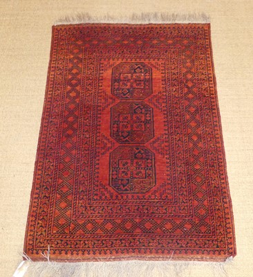 Lot 740 - A Persian Turkmen rug, the red ground with...