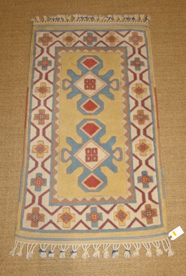 Lot 750 - A Turkish woolen Oushak rug, with white and...