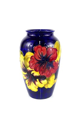 Lot 222 - A Moorcroft Hibiscus pattern pottery vase, of...