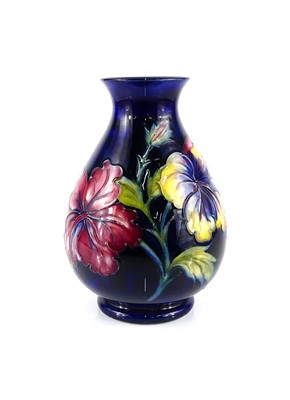 Lot 163 - A Moorcroft Hibiscus pattern pottery vase, of...