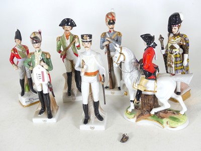 Lot 113 - A collection of seven porcelain military...