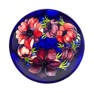 Lot 172 - A Moorcroft Anemone pattern pottery circular...